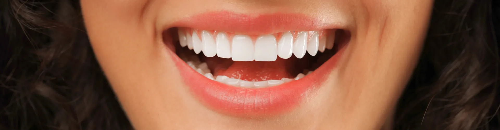 Woman smiling.